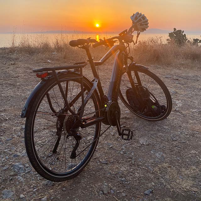 Biking at sunset—a warm rays, cool breeze